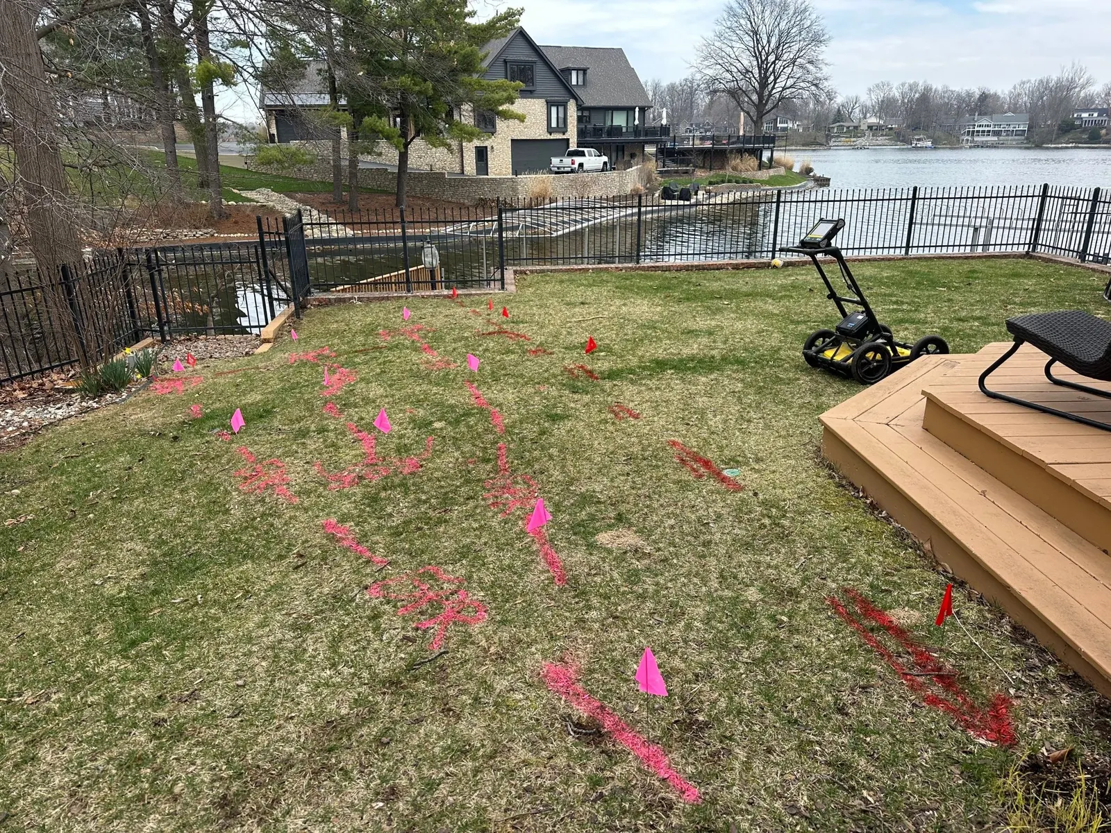 Painted utility markings and flags documenting findings across a project area